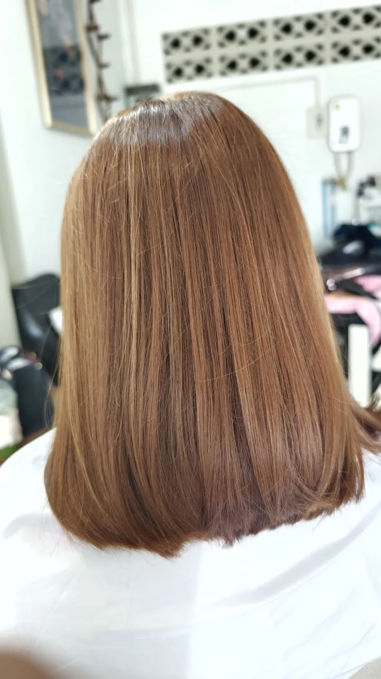 Caramel brown straight bob, seen from behind